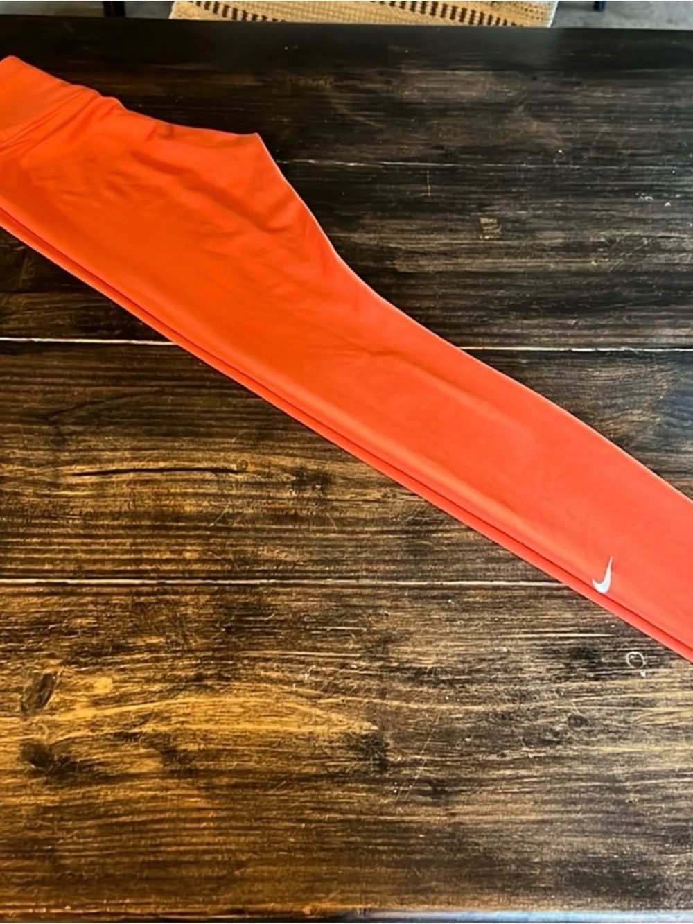 Nike Kids Orange Performance Leggings with White Swoosh
